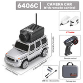 Silver remote control camera car with trailers, controller, USB accessories, and carry case