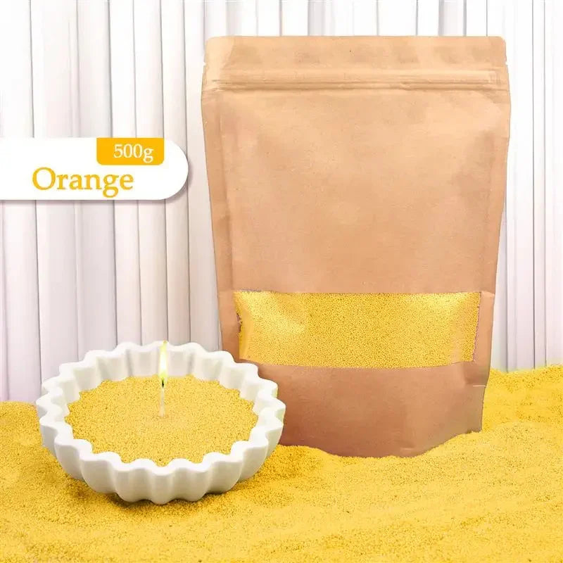 Orange candle sand wax in kraft bag, displayed in white bowl and loose for home decor.