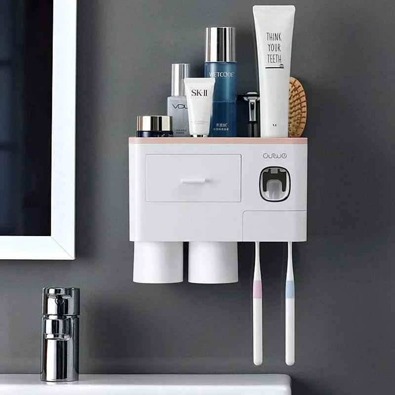 Wall-mounted white plastic bathroom organizer with cups and compartments, holding toiletries and toothbrushes
