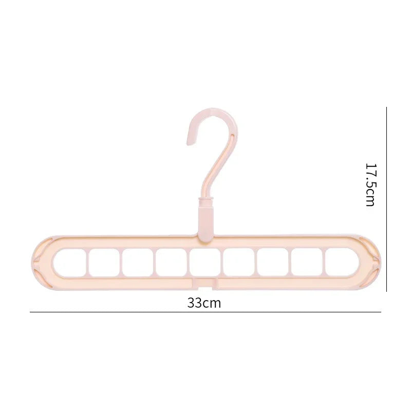 Beige plastic multi-slot clothes hanger with nine openings, 33cm wide, 17.5cm high