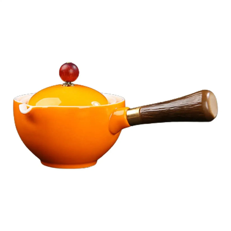 Modern orange ceramic saucepan with round lid and wooden handle, minimalist design
