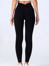 Black high-waisted leggings with ruched back, slim fit, stretchy fabric, ideal for streetwear or activewear