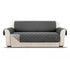 Beige sofa with a fitted dark gray quilted protective cover, modern minimalist style