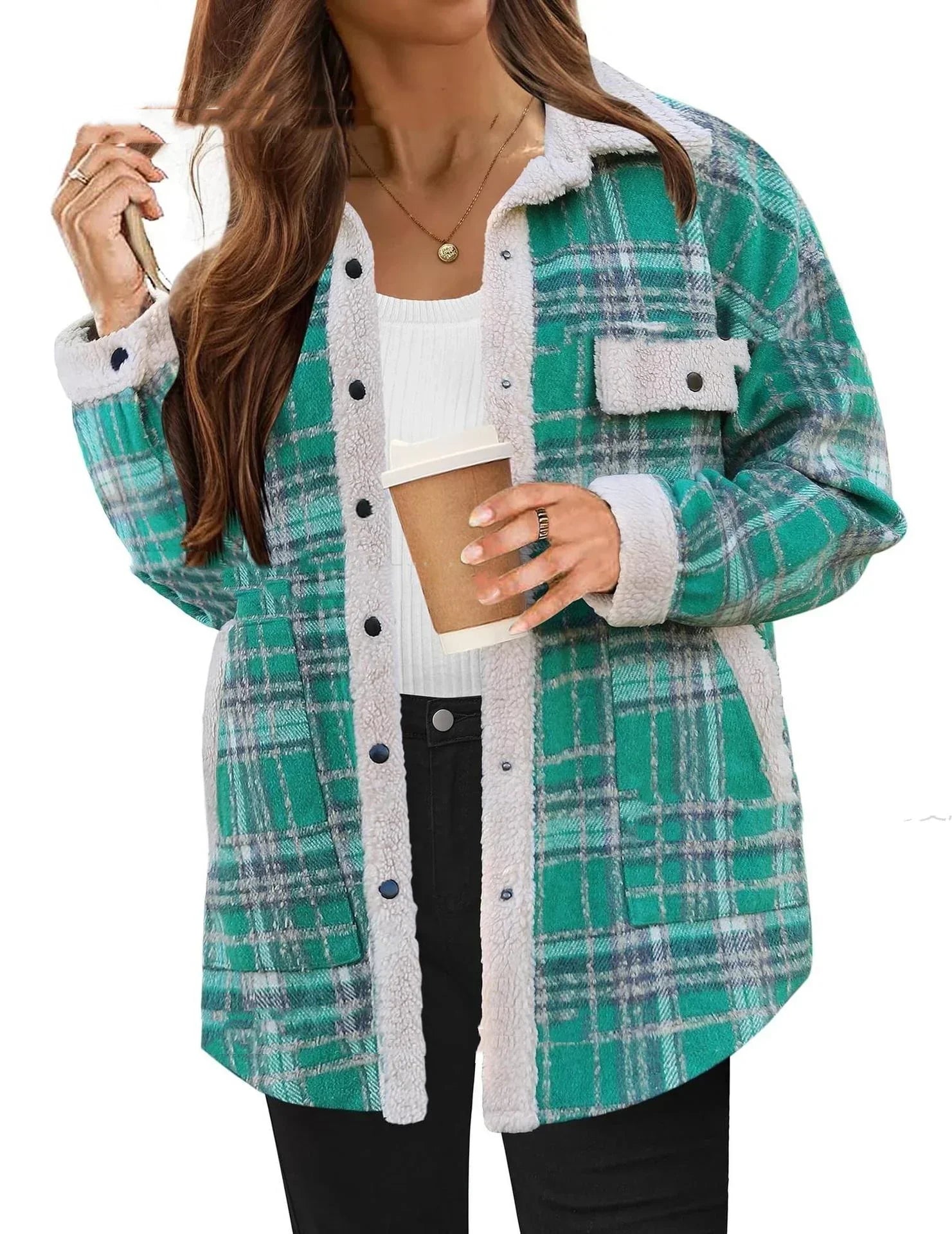 Woman wearing green plaid sherpa jacket with button front, relaxed fit, and fuzzy trim