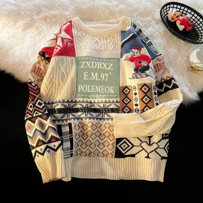 Patchwork knit sweater with multicolor geometric patterns, graphic print, and relaxed fit.