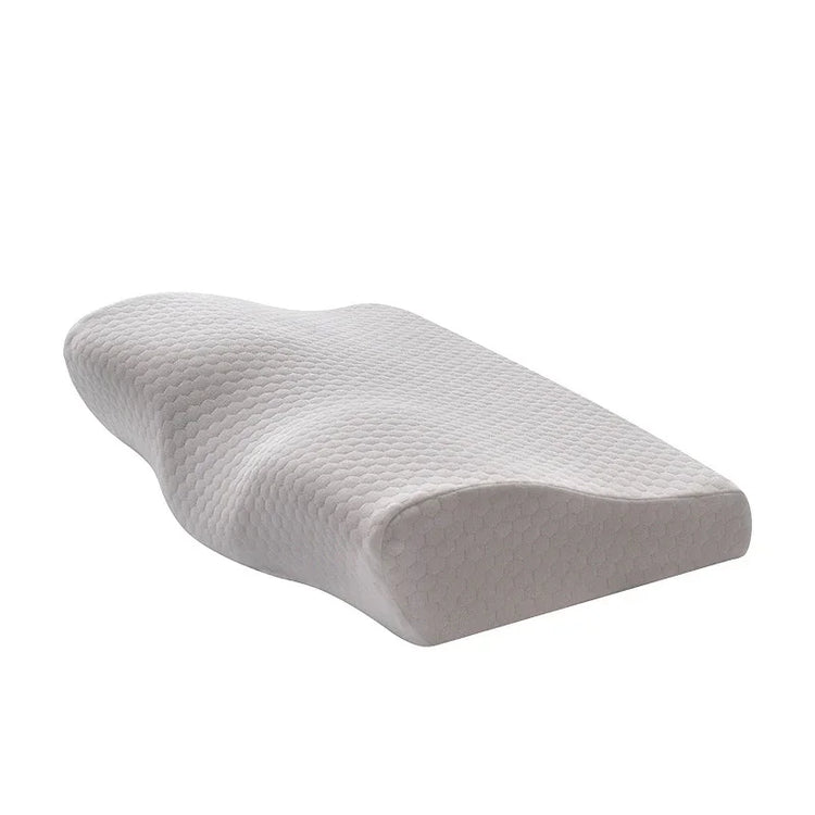 Contoured white memory foam pillow with textured cover, ergonomic design for neck support