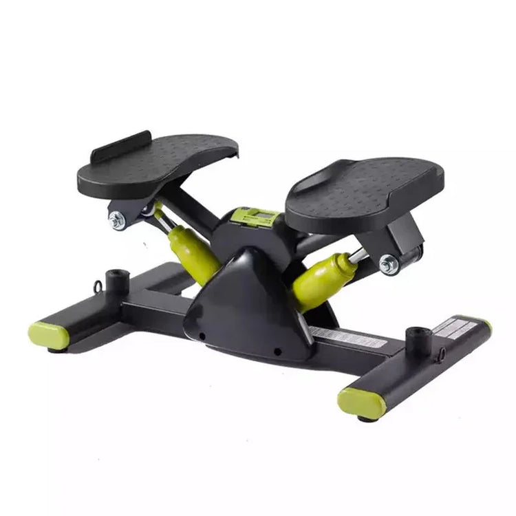Compact black and green mini stepper exercise machine with textured foot pedals