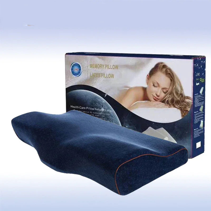 Ergonomic memory foam pillow with dark blue cover, contoured for neck support, packaged box in background.
