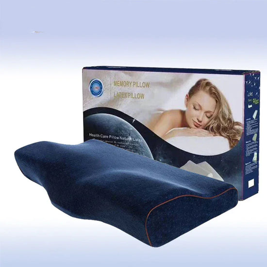 Ergonomic memory foam pillow with dark blue cover, contoured for neck support, packaged box in background.
