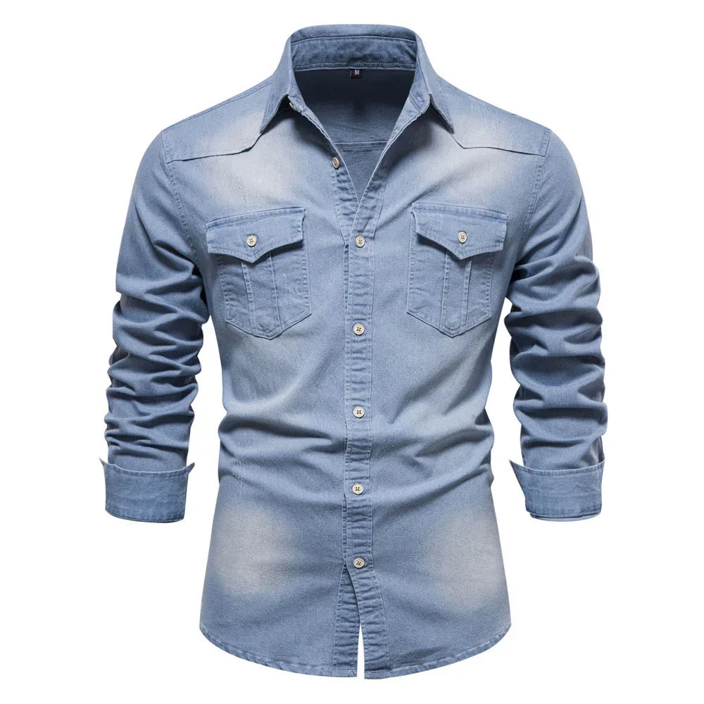 Men's light blue denim shirt with long sleeves, button-up front, and chest pockets.