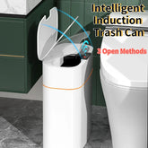 White smart induction trash can with automatic lid in modern bathroom setting