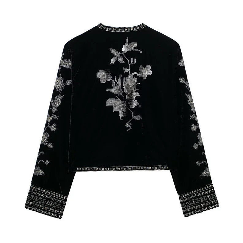 Black velvet long sleeve top with silver floral embroidery and geometric trim, relaxed fit