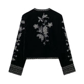 Black velvet long sleeve top with silver floral embroidery and geometric trim, relaxed fit