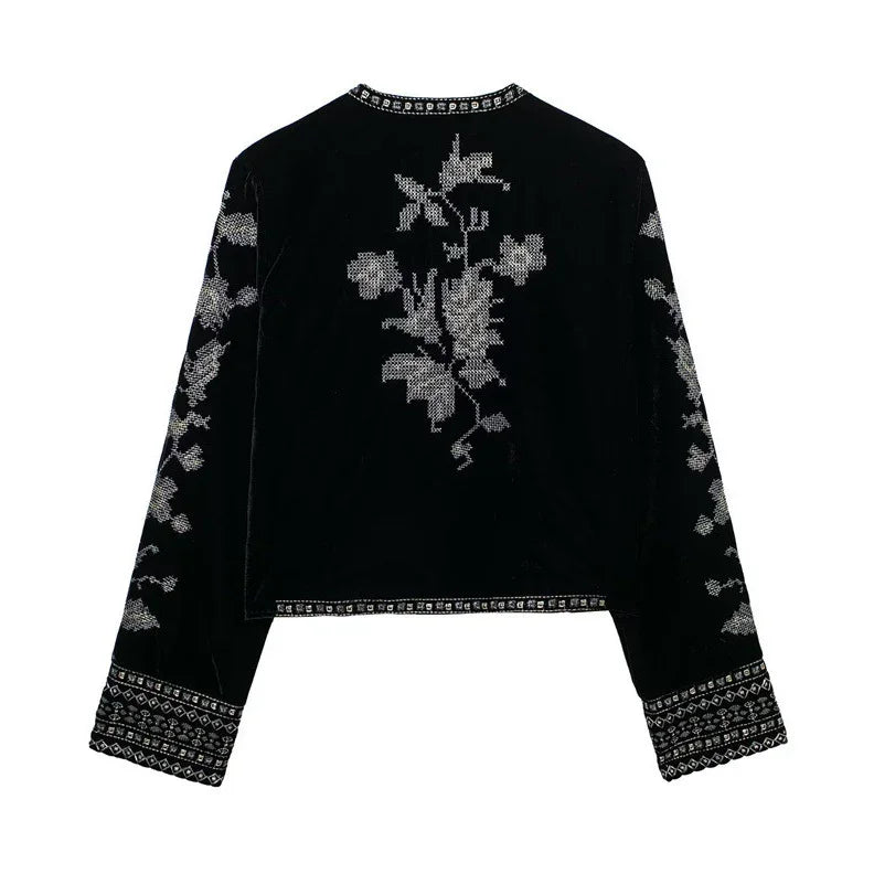 Black velvet long sleeve top with silver floral embroidery and geometric trim, relaxed fit