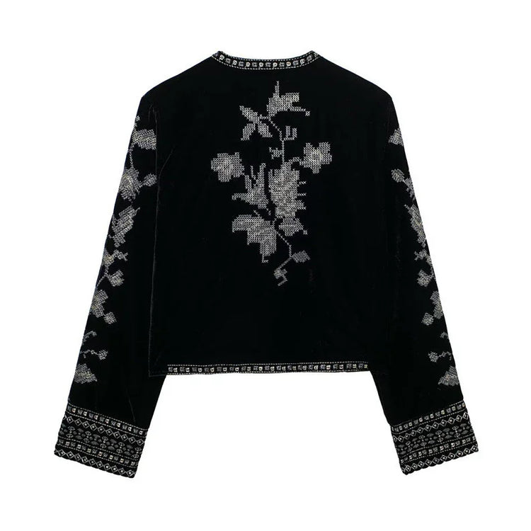 Black velvet long sleeve top with silver floral embroidery and geometric trim, relaxed fit