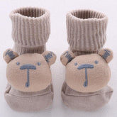 Beige knit baby socks with bear face design, ribbed cuffs, soft cotton material, cozy fit
