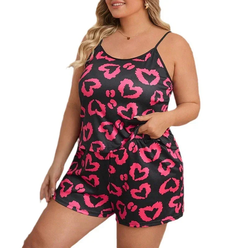 Black satin pajama set with pink heart print, sleeveless, relaxed fit for women