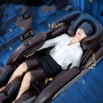 Woman in white blouse and black skirt reclining in a leather massage chair, relaxed fit.