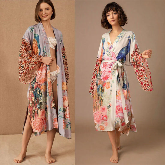 Women wearing long floral satin kimono robes with wide sleeves, relaxed fit, and pastel prints