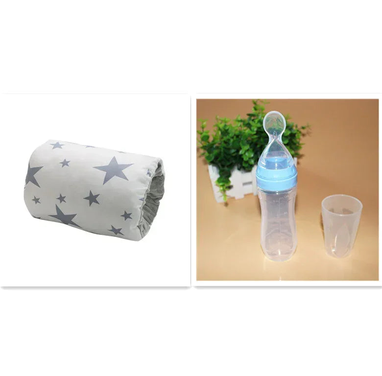White fabric cover with gray star print, next to a clear plastic baby bottle with blue lid