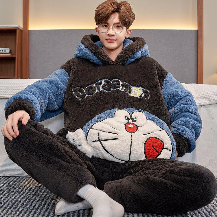 Man wearing oversized, plush fleece hoodie with cartoon graphic, blue sleeves, relaxed fit