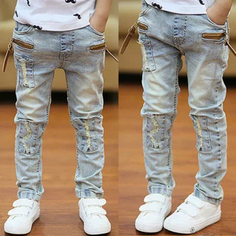 Kids' light blue distressed skinny jeans with zipper and patch details, casual fit
