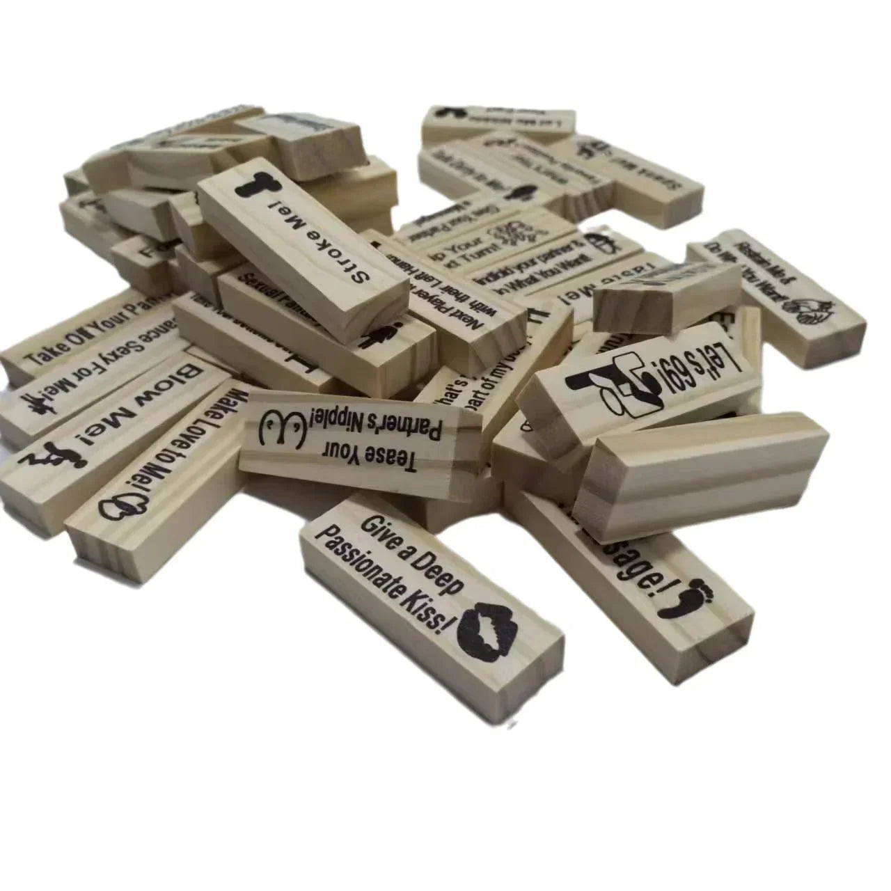 Pile of wooden blocks with printed adult game prompts and icons, party game pieces