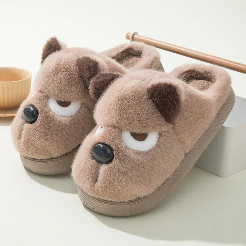 Fuzzy brown bear face slippers with plush material and closed-toe fit on light background