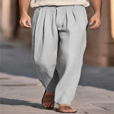 Loose fit light gray pleated linen pants, relaxed streetwear style, worn with sandals