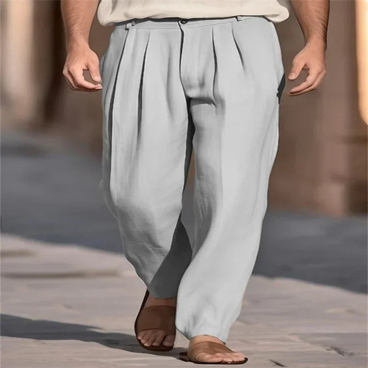 Loose fit light gray pleated linen pants, relaxed streetwear style, worn with sandals