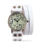 Vintage-style quartz wristwatch with large face and white leather wrap strap