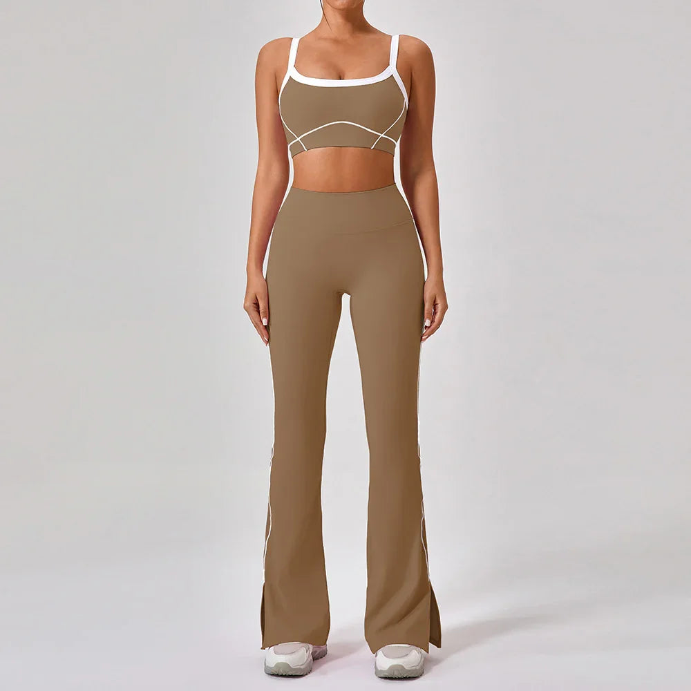 Woman wearing brown fitted two-piece athleisure set with white trim and flared pants