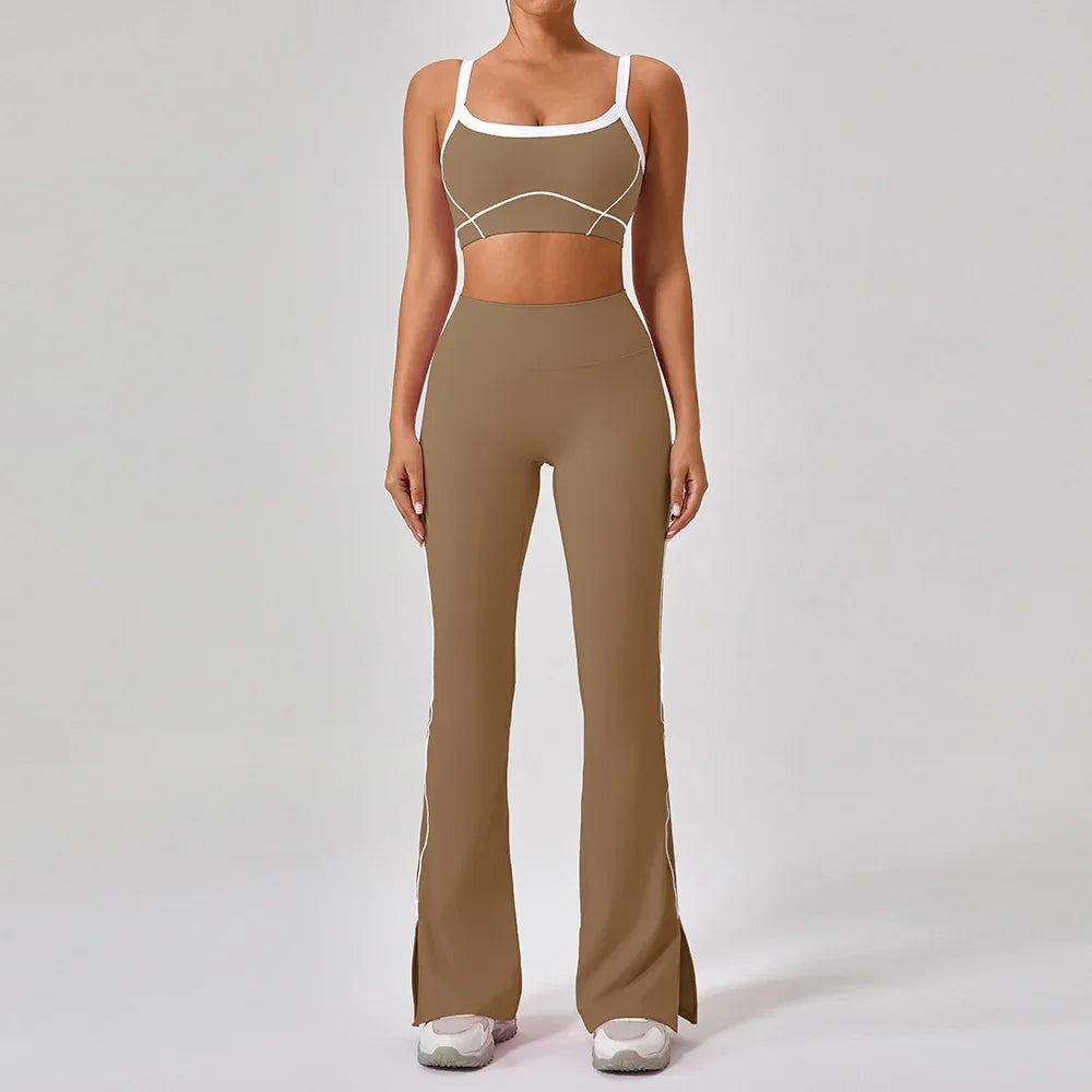Woman wearing brown fitted two-piece athleisure set with white trim and flared pants