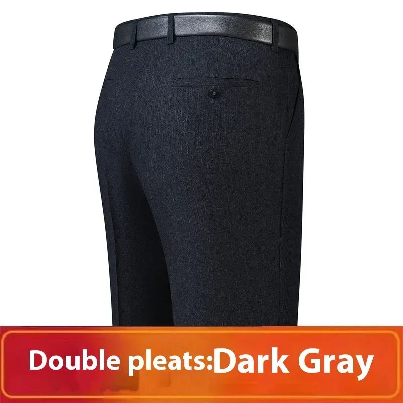 Double pleated dark gray dress pants with tailored fit and single back pocket, shown from rear.