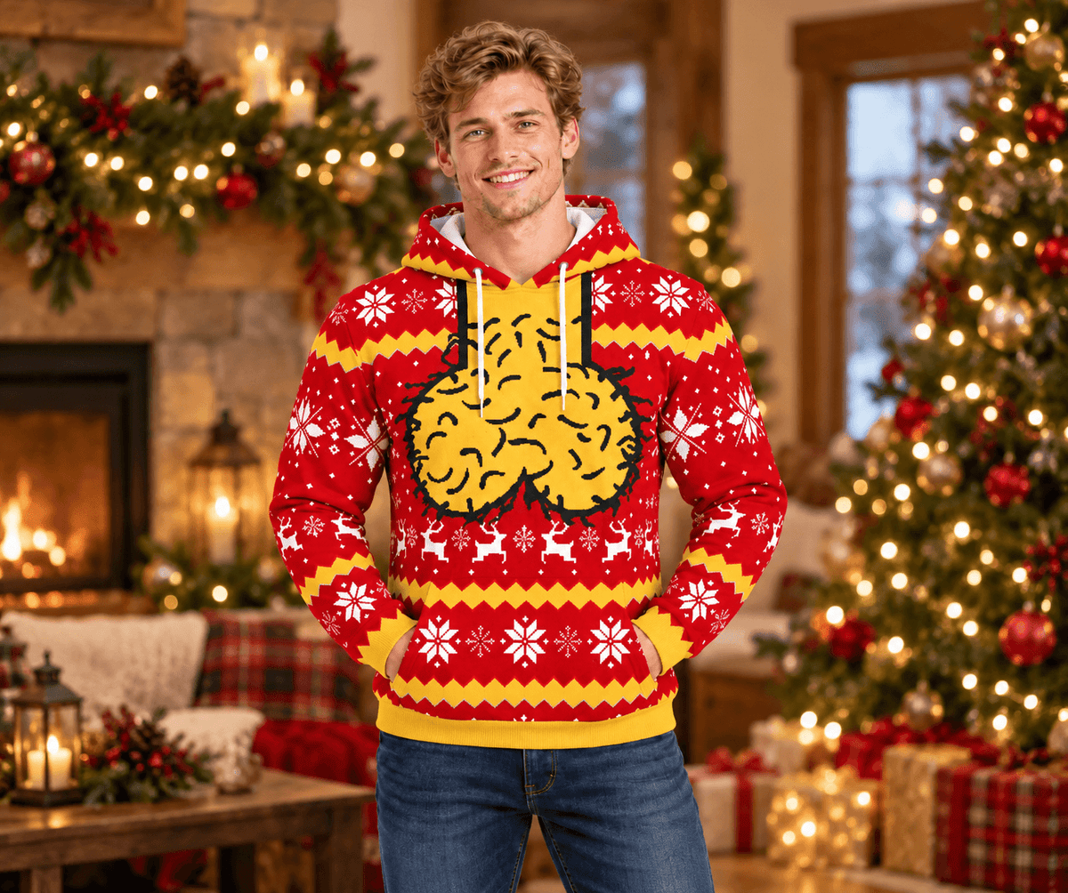 Model wearing a red adult humor Christmas hoodie in a festive room
