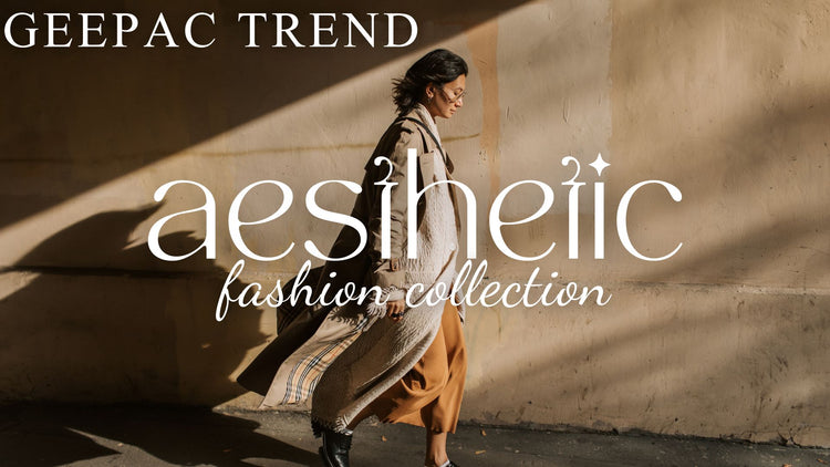 Woman in beige trench coat, cream scarf, and brown pants walking past sunlit wall — aesthetic streetwear style