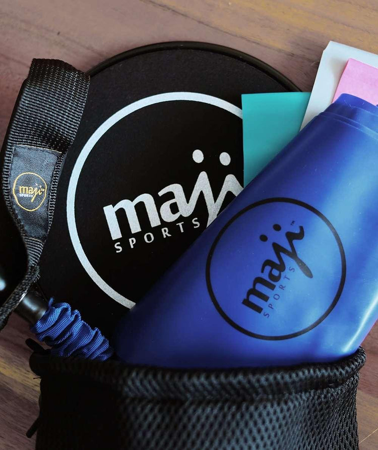 Black and blue sports accessories with mesh pouch and elastic band, close-up view.