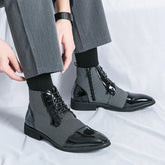 Black and white checkered lace-up ankle boots with glossy leather, paired with gray trousers