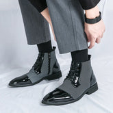 Modern black and white houndstooth ankle boots with glossy patent leather and lace-up design.
