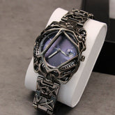 Futuristic streetwear watch with metallic skeleton frame, purple dial, and intricate chain strap