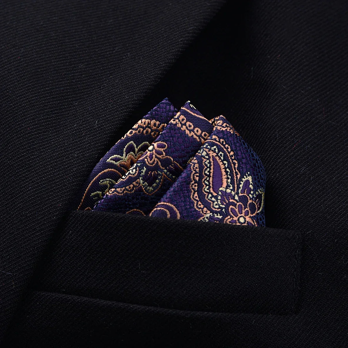Purple paisley silk pocket square in black tailored blazer pocket, elegant fit