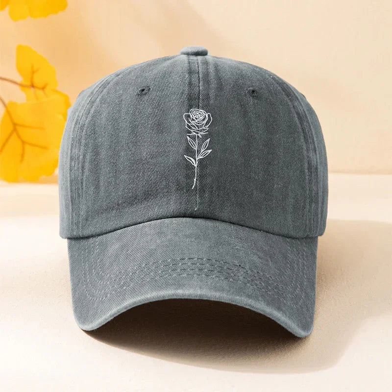 Gray cotton baseball cap with white embroidered rose, adjustable fit, casual style