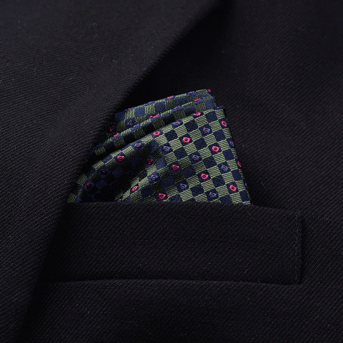 Navy blazer with patterned silk pocket square in green and blue, tailored slim fit