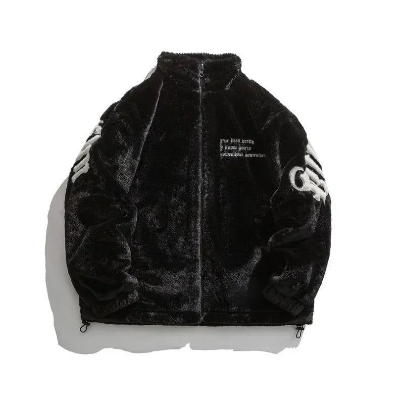 Black faux fur zip-up jacket with white embroidered text and bold white patches on sleeves.