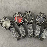Futuristic silver metal watches with abstract case design, grey and red dials, and patterned bands.