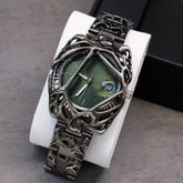 Futuristic black metal watch with green dial and skeletonized geometric bracelet