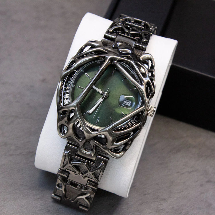 Futuristic black metal watch with green dial and skeletonized geometric bracelet