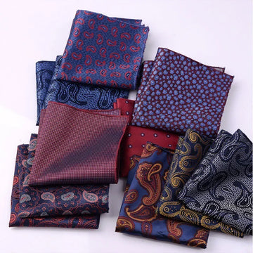 Assorted silk pocket squares in blue and burgundy paisley and geometric patterns