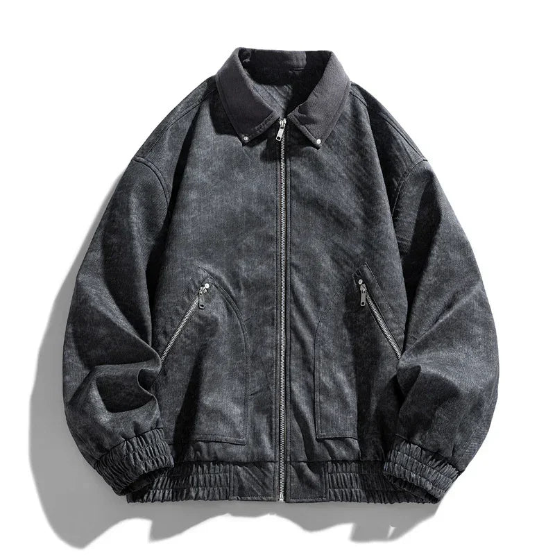 Dark washed bomber jacket with zip closure, elastic cuffs, and front zip pockets, relaxed fit