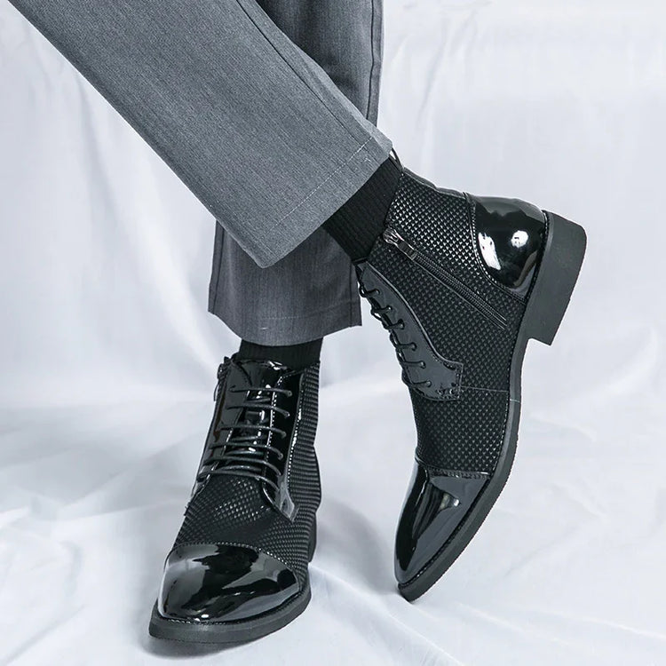 Black patent leather and mesh lace-up dress boots with zipper, paired with grey trousers